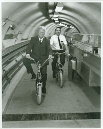 Hans Bethe and Boyce McDaniel bicycling in the Wilson Synchrotron