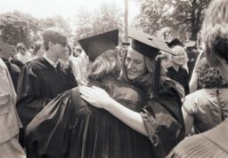 Two students hug on Commencement day
