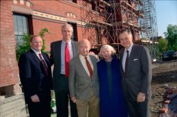 Dean Robert Swieringa, Pres. Rawlings, Samuel C. Johnson, Mrs. Johnson standing outside Sage (different pose)