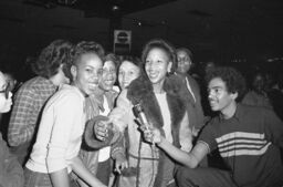 Wimpy and several young women at Harlem World