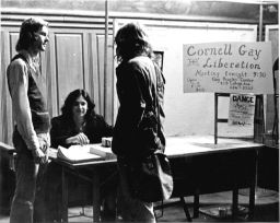 Students at an information table for Cornell Gay Liberation
