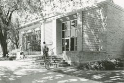 Student entering the Samuel Appleton-Carnegie Library