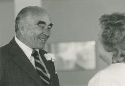 Mojmir Povolny speaking to a woman