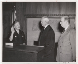 Mary Honor Donlon, also known as Mary Donlon Alger, being Sworn in as a Judge, U.S. Customs Court, By Judge Elbert P. Tuttle; Attorney General Herbert Brownell Jr. at right