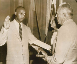 Morrow Joins President's Staff: Everett Frederic Morrow of Hackensack, New Jersey, today is sworn in as a member of President Eisenhower's executive staff by Frank Sanderson, right, White House administrative officer. Sherman Adams, assistant to the president, looks on. Morrow becomes administrative officer for the special projects group. He is the first Negro named to a top job in Eisenhower's executive office, July 11, 1955