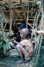 Children playing "shop" in lower village neighborhood