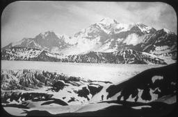 Mt. St. Elias from west end of sound over hills, glacier in foreground
