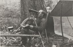 Allen, Seated, Looking Through Binoculars