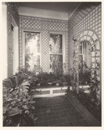 Interior room of a room of the conservatory at the Andrew Dickson White House with lattice work on the wall
