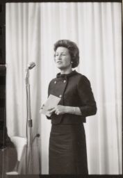 Unidentified woman at microphone, Frame #2