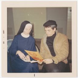 Daniel Berrigan and nun looking at Full Circle