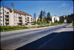 Several multi-story residential buildings along a road (Haaga, Helsinki, FI)