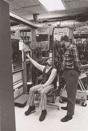 Two men at electrical engineering apparatus ca. 1970's