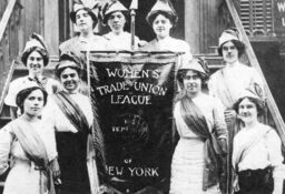 Members of the Women's Trade Union League (WTUL) of New York pose with a banner calling for the 8 hour day