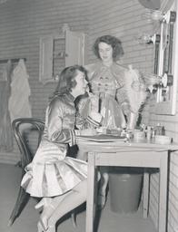 Woman at mirror, "Heart of a City" production