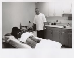 Gannett Medical Clinic: Ray Morey and student undergoing back therapy
