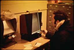 Professor Toby Berger operating Vantage microfiche reader