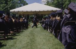 View down aisle in between rows of students during Commencement