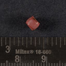 Red drawn glass bead with black core