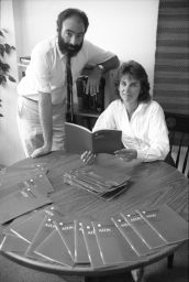 Frame 21: Dr. Leslie Elkind with Jan Talbot and AIDS pamphlet