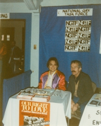 Two men at a National Gay Task Force booth