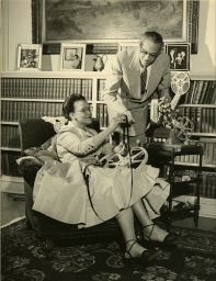 Sadie T.M. and Raymond Pace Alexander, with movie projector