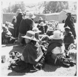 Women seated in plaza Entierro
