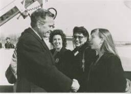 Jennifer Knight shakes the hand of then President George H. W. Bush