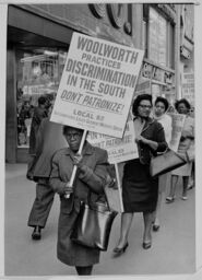 People picket against the Woolworth Company's practice of segregation
