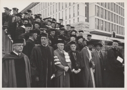 Dignitaries standing on Olin Library terrace, including Deane W. Malott and Arthur H. Dean, at Centennial celebration