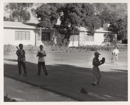 Children playing baseball, Baldwin Hills Village.