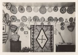 Photograph of Native American baskets and a blanket displayed in a home.