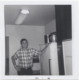 Daniel Berrigan in a kitchen
