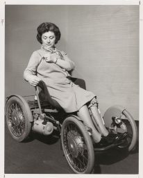 Woman in wheelchair inspecting her jacket