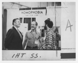 Three people at the National Gay Task Force display at the 1973 APA Convention