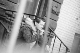 Man seated on steps, South Bronx