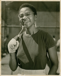 Betty Powell with a tennis racket