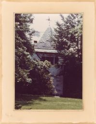 Color photo of the front entrance and weather vane of Olive Tjaden's home