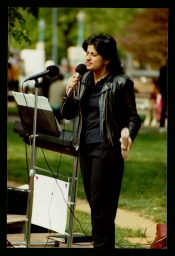 Urvashi Vaid speaking at a park