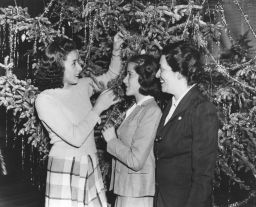 Colombian student visit Penn for six weeks during the winter 1941-1942: three of the 32 students in front of a Christmas tree