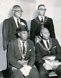 Prince Hall's Ideals Lauded: Principals at a program Sunday commemorating the birth of Prince Hall, founder of Negro Freemasonry in America, include (seated, left) Calvin I. Johnson, Program Chairman, and Dr. Daniel W. Wynn, Tuskeegee Institute Chaplain and principal speaker. Standing are O. C. W. Taylor (left), Public Relations Director for the Prince Hall Mason's Grand Lodge of Louisiana, and A. Victor Williams, Deputy Grand Master of Louisiana, September 10, 1962.