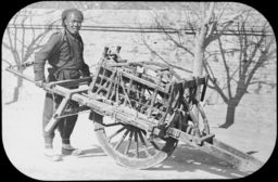 Man with wheelbarrow, near Peking, China