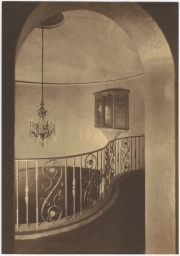 Interior photo: Upstairs balcony railing and chandelier for residence of Ralph B. Maltby