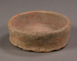 Annular base fragment of medium sized bowl with double  slipped white then red exterior