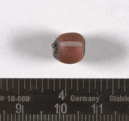 Red drawn glass bead with white stripes and green core