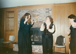 Women smoking and talking at a party