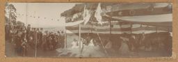 [Panoramic view of traditional Korean performance and Koreans in formal western dress]