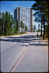 Street towards a residential high-rise (Haaga, Helsinki, FI)
