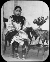 Chinese girl with bound feet, sitting, Tianjin (Tientsin), China