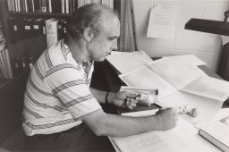 Donald Bartel at desk